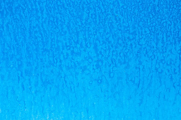 Mavi boyalı duvar doku veya arka plan. Akrilik duvar lekeleri ile boyalı. Arka plan