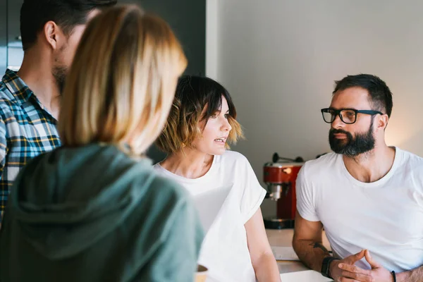 Team of financial analysts are discussing new strategy points at the annual meeting. Group of hipsters are thinking on a new project concepts in the rented office. Business people brainstorming.