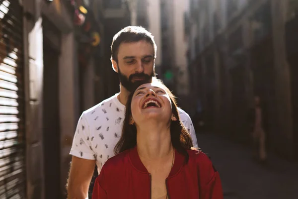 Attractive Woman Laughing Her Beloved Man Cuddles Her While Standing — Stock Photo, Image