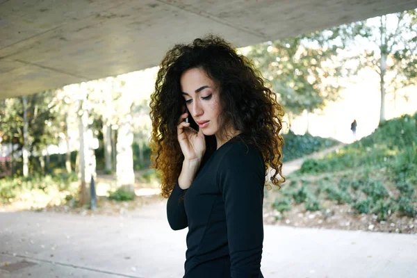 Beautiful Young Businesswoman Black Dress Talking Smartphone Outdoors Royalty Free Stock Images