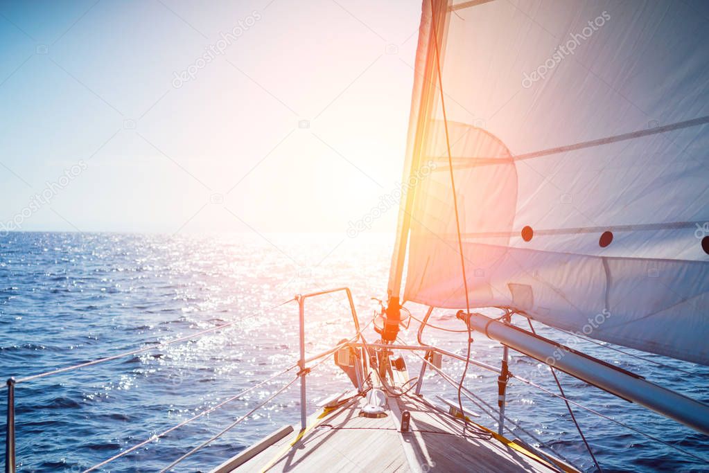 Sailing yacht boat on ocean water at sunset. a wonderful view of the sea from the yacht