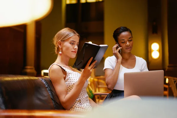 Two Female Freelancers Preparing Meeting While Waiting New Client Come Stock Image