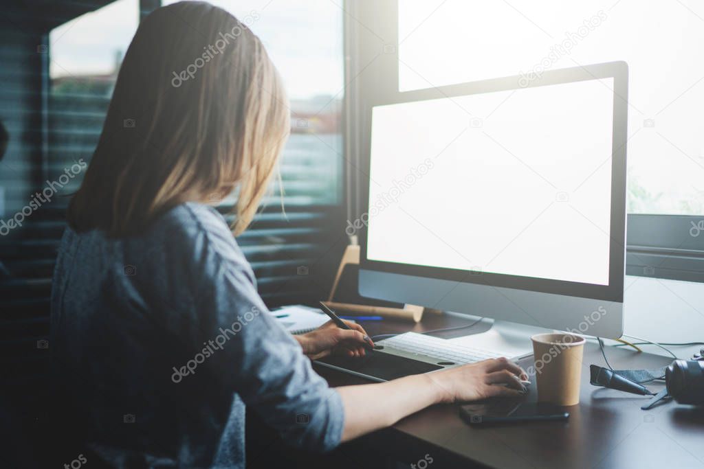Beautiful young woman working with computer at workplace
