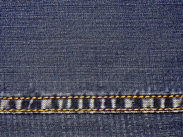 Jeans An element of denim clothing. Allocated seams with a yello — Stock Photo, Image