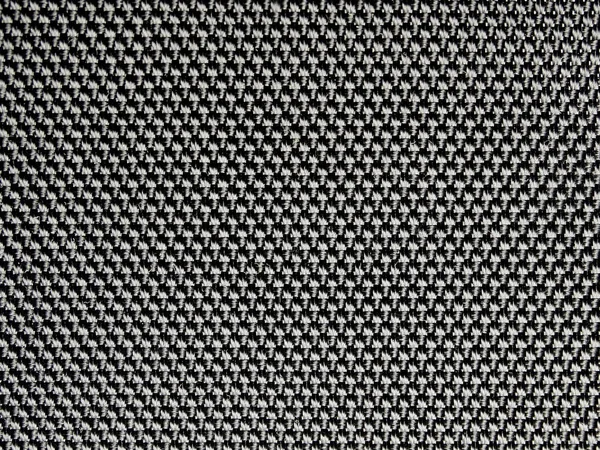 Háttér. Textúra, fehér luste fekete szintetikus anyagból — Stock Fotó
