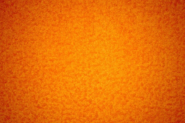 Текстура. Ярко-оранжевый цвет со светлыми, желтыми, округлыми частицами . — стоковое фото