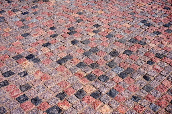 Doku. Granit kaldırımlar. Gri granit. Kare taşlar.