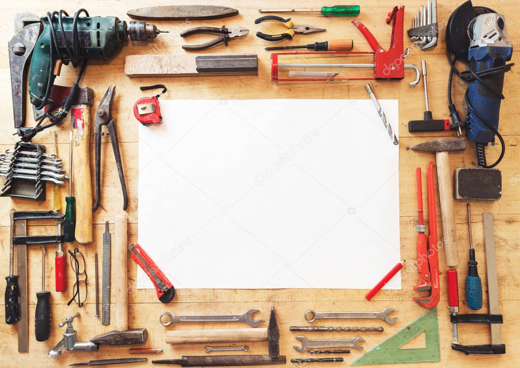 Various Tools  and paper on a wooden table