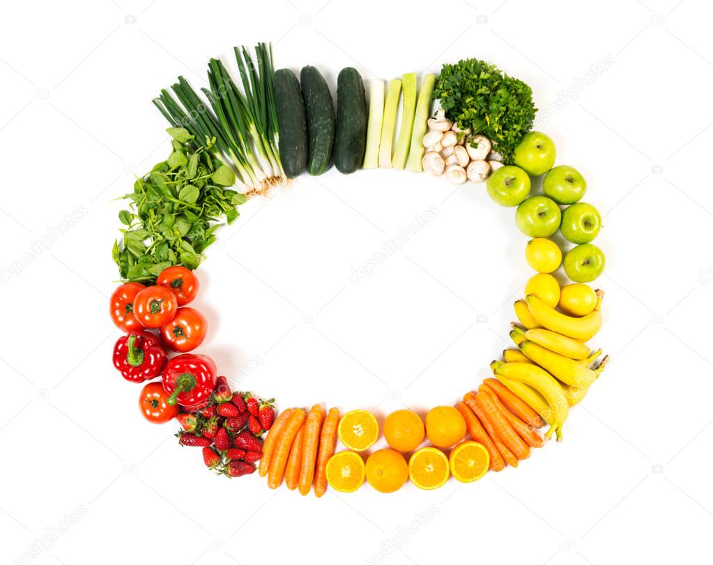 Frame made out of fruits and vegetables isolated on white background