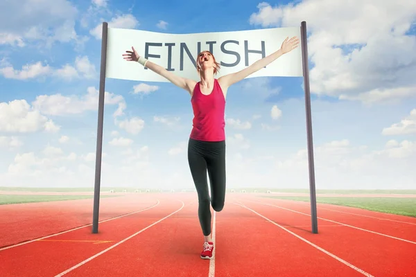 Woman Runner Crossing Finish Line — Stock Photo, Image