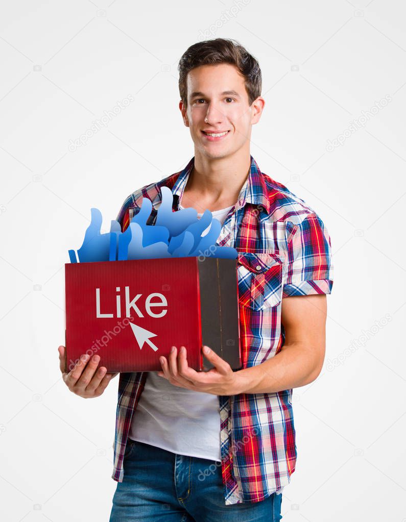 Young man holding a box full of likes