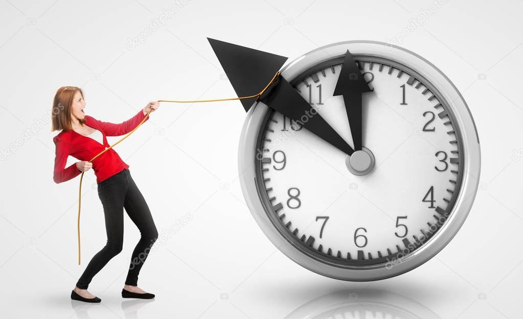 Woman pulling clock hands backwards