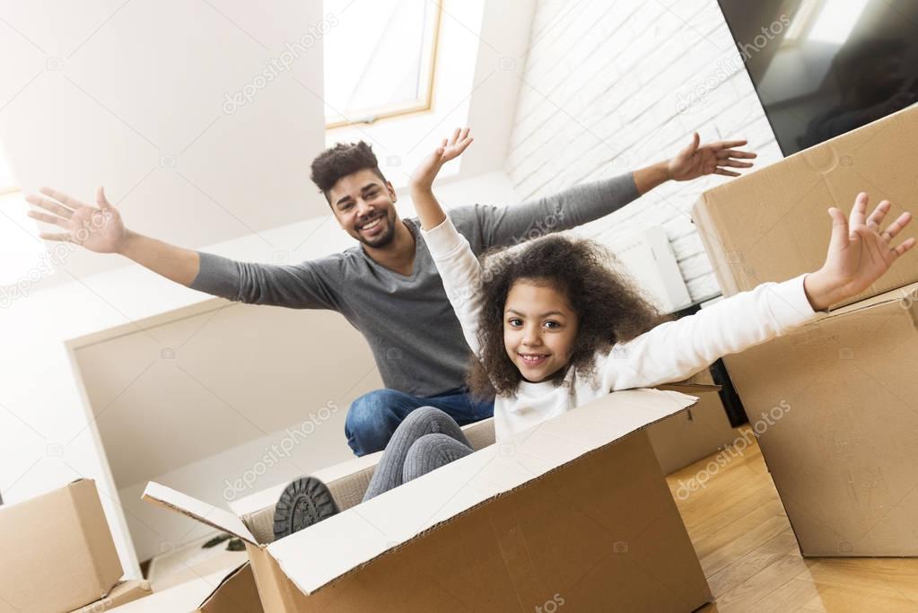 Man and his daughter moving into their new home