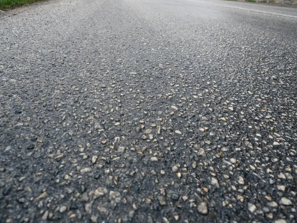 Bakgrund av asfalt textur närbild. — Stockfoto