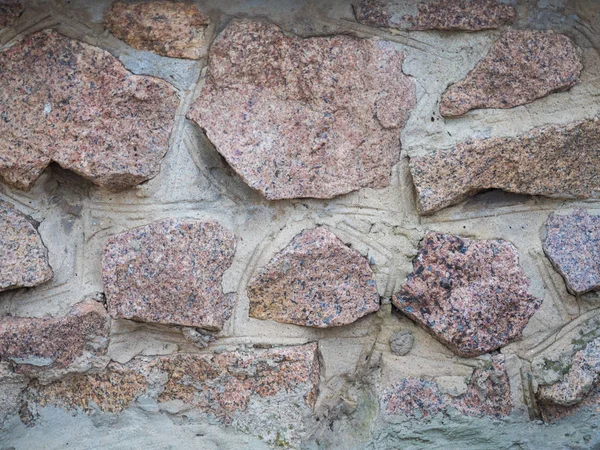 Фон природной текстуры грубой каменной стены вблизи . — стоковое фото