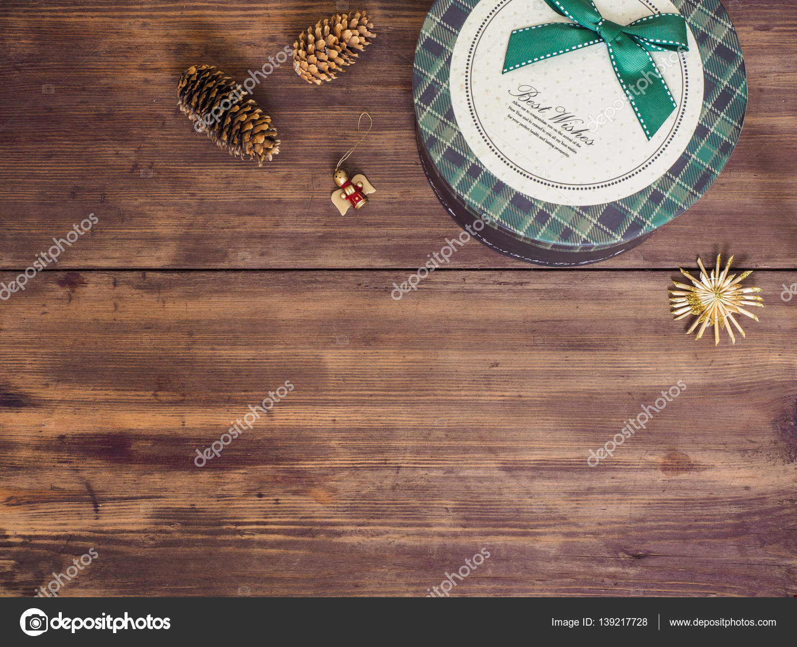 Vintage t box fir cones with Christmas toy on wood background copy space for text