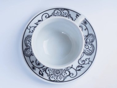 Beyaz arka plan üzerinde üstten görünüm izole tasarımları ile dekore edilmiş kahve Kupası.