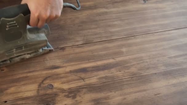 Close up hands of male, carpenter holding grinder and smoothing wood plank. — Stock Footage Close up hands of male, carpenter holding grinder and smoothing wood plank. Video Clip