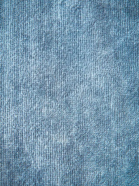 Uma página inteira de material falso. Macro têxtil, textura de tecido de malha. Vista de cima na textura de fundo. Textura trançada close-up . — Fotografia de Stock