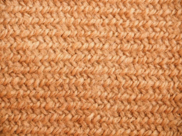 Una página completa de material sintético falso. Jersey marrón macro, textura de lana de punto. Vista de la parte superior sobre la textura de fondo. Textura de lana trenzada de cerca . —  Fotos de Stock