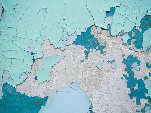 Kırık doku boya. Eski boya duvar eski sıva ve boya yüzey yakın çekim birkaç kat üzerinde. Arka plan doku renkli makro fotoğrafçılık.