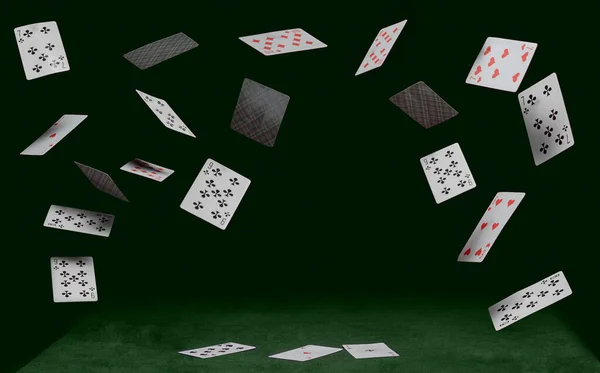 Hrací karty padají na koťátko sedící na zeleném stole — Stock fotografie