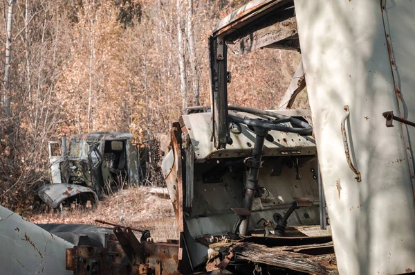 abandoned broken equipment in the Chernobyl forest