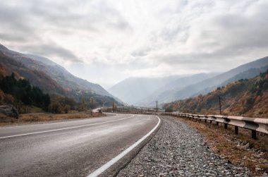 background mountain road and sky with clouds in the afternoon in Georgia