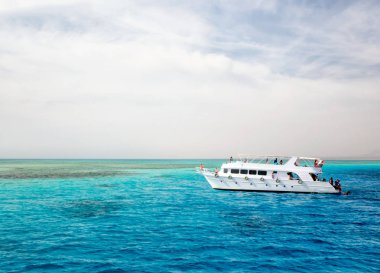 white cruise tourist boat in the Red Sea in Egypt