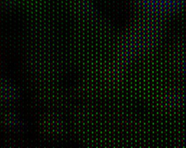 Koyu arkaplandaki renkli bulanık noktaların soyut arkaplan deseni