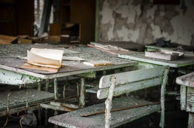 school room desk and book in Chernobyl close up