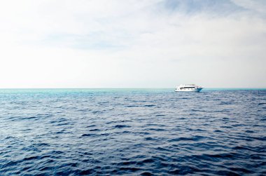 white cruise tourist boat on the background of the coast in the Red Sea in Sharm El Sheikh Egypt