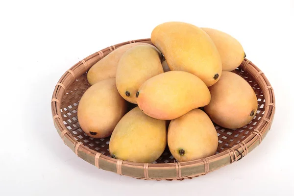 Golden ripe mangoes in basket on white background — Stock Photo, Image