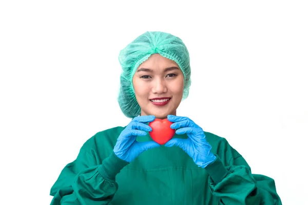 Ärztin mit Herz auf weißem Hintergrund — Stockfoto
