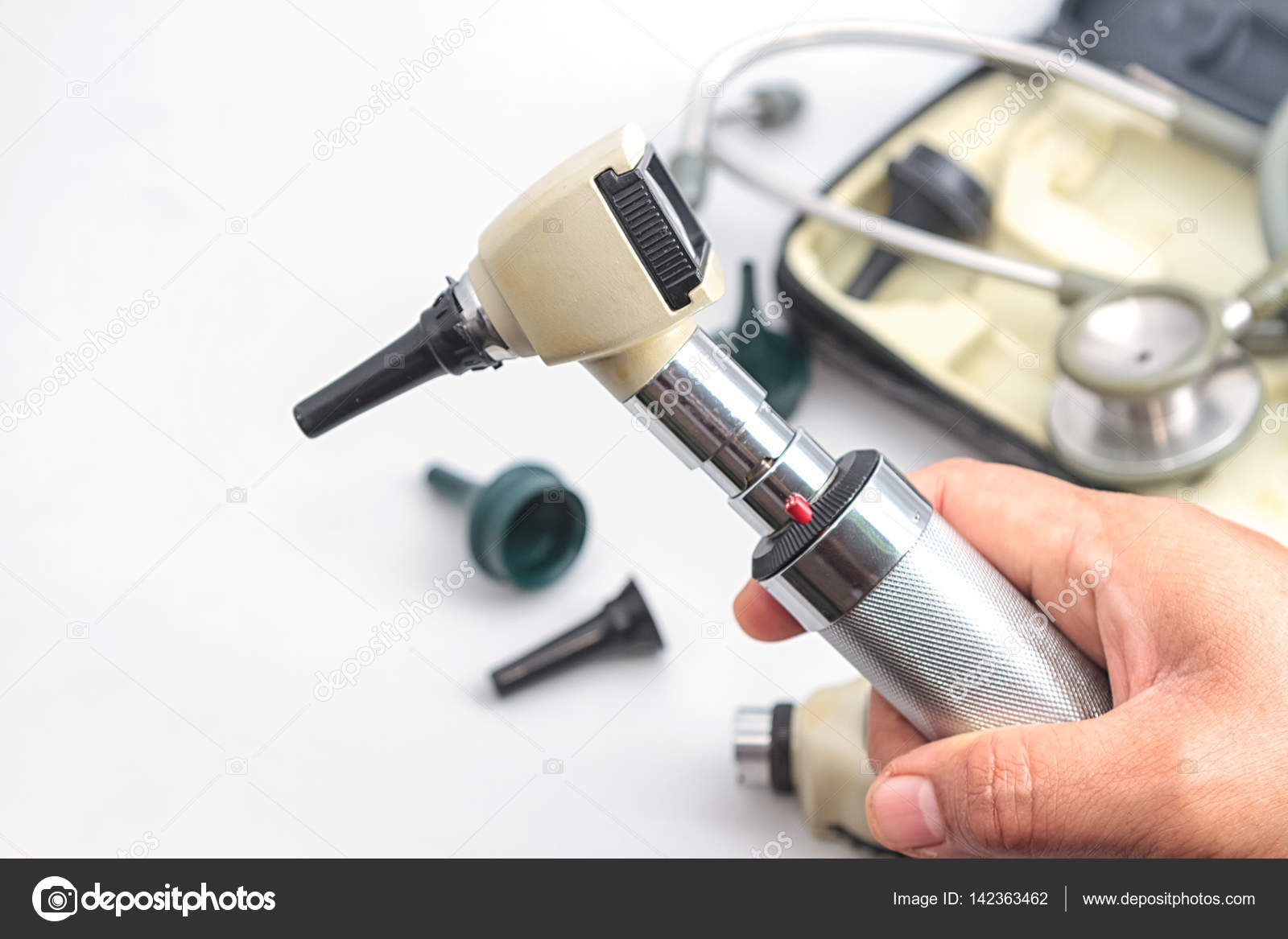 Otoscope, medical instrument on white background. Stock Photo by  ©plepraisaeng 142363462