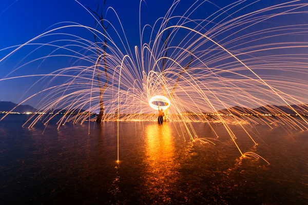 Burning Steel Wool spinning,Circle fire at sunset