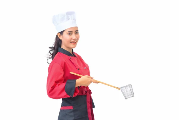 Smiling woman chef holding cooking utensils — Stock Photo, Image