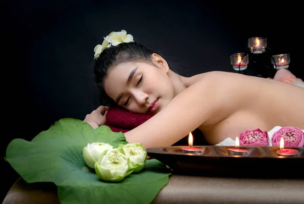 Happy relax woman in spa salon lying on the massage desk — Stock Photo, Image