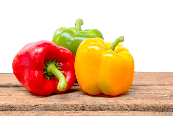 Colorful  peppers on wooden background — Stock Photo, Image