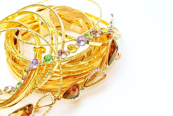 Golden jewelry with precious stones — Stock Photo, Image