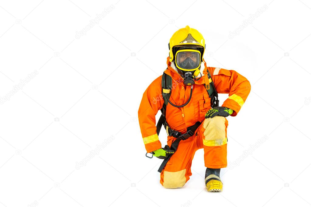 Firefighter in uniform and safety helmet standing full body leng
