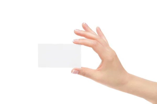 Elszigetelt női kéz tartja fehér kártya egy fehér háttér. — Stock Fotó