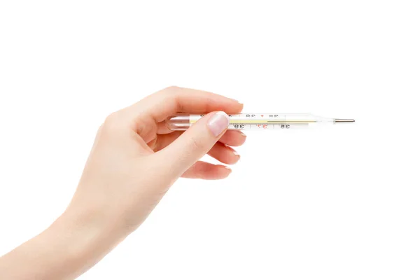 Female hand holds thermometer on a white background. — Stock Photo, Image