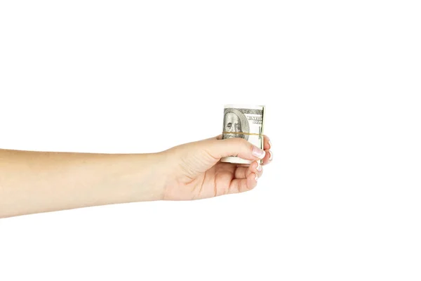 Female's hand holds twisted stack of dollars on white background — Stock Photo, Image