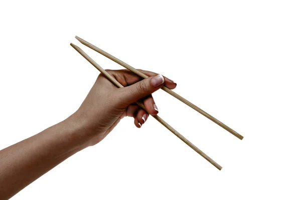 African female hand holds chopsticks on a white background. — Stock Photo, Image