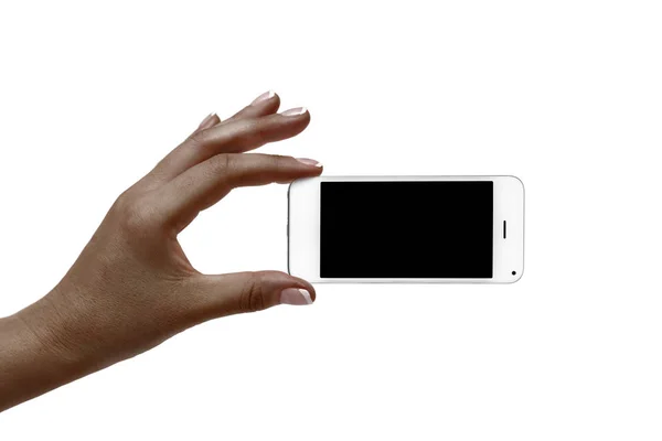 Рука африканки держит белый телефон на белом фоне . — стоковое фото