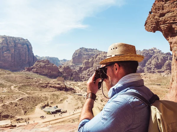 Tourist with a vintage camera. Petra, Jordan.