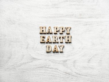 Dünya Günü. Güzel tebrik kartı. İzole edilmiş arka plan, yakın çekim, yukarıdan manzara, ahşap yüzey. Akrabalar, arkadaşlar ve meslektaşlar için tebrikler.