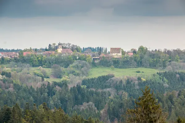 Small hills, small village, green meadows and green forests — Stock Photo, Image