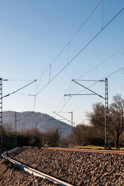 Power lines and rails along the countryside ready for transport